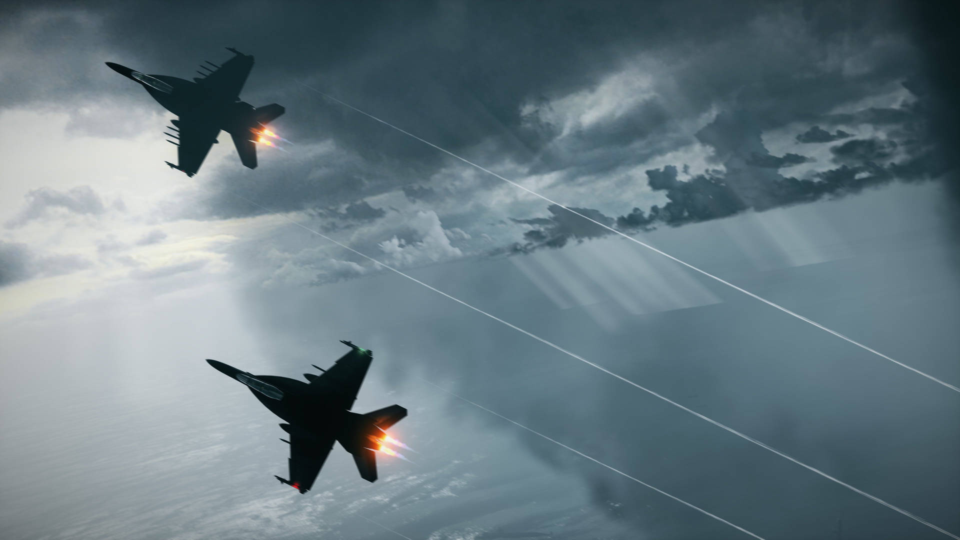 A Pair Of Fighter Jets Flying In The Sky Wallpaper