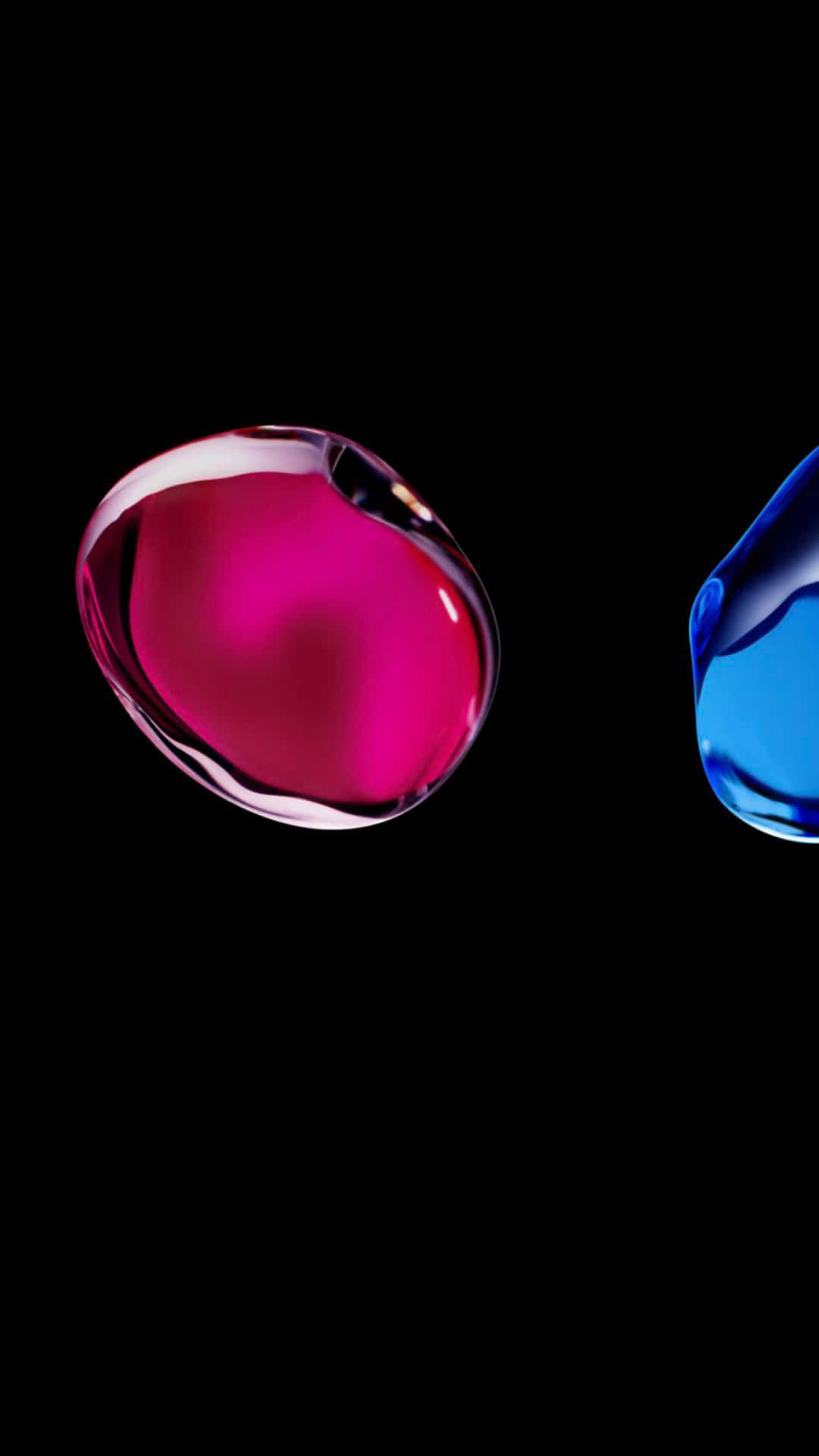 Two Blue And Pink Liquids On A Black Background Wallpaper