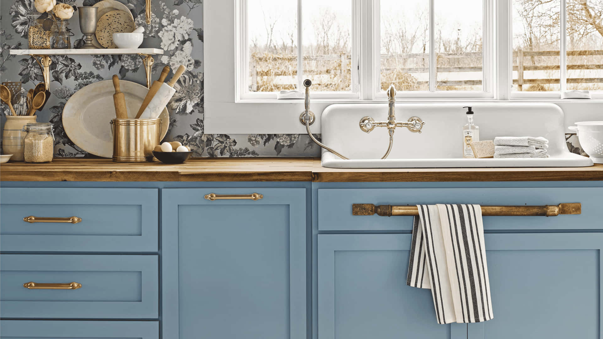 A Blue Kitchen With A Sink And A Window