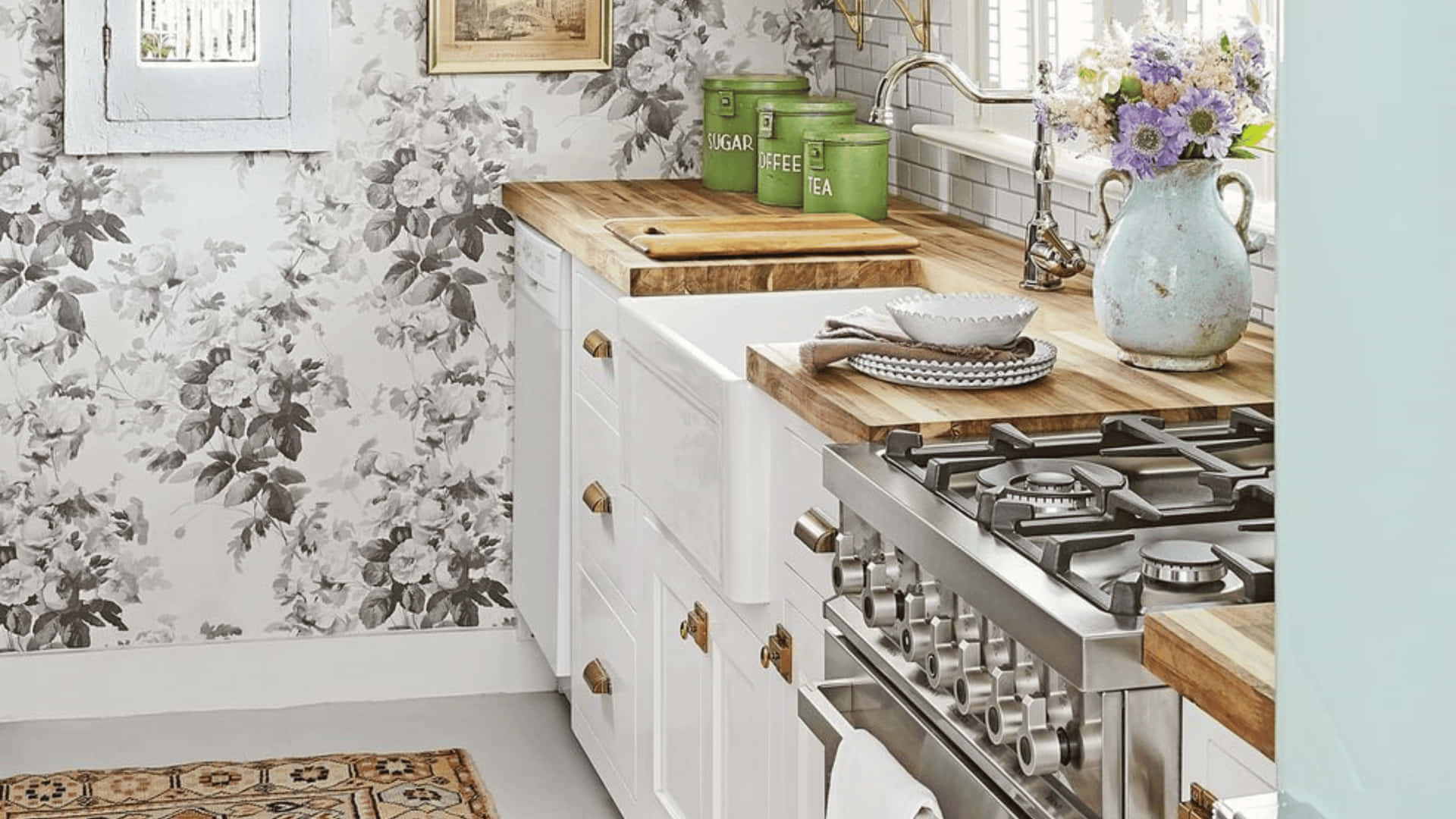 A Kitchen With Floral Wallpaper And A Stove