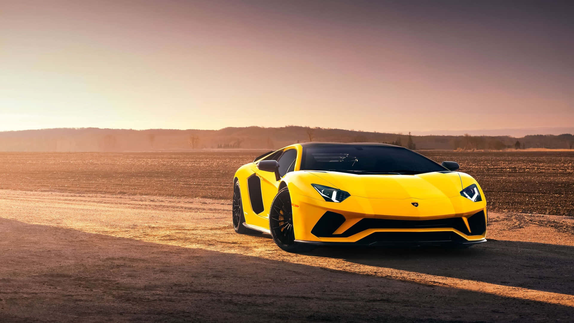 A Yellow Sports Car Is Parked In The Desert
