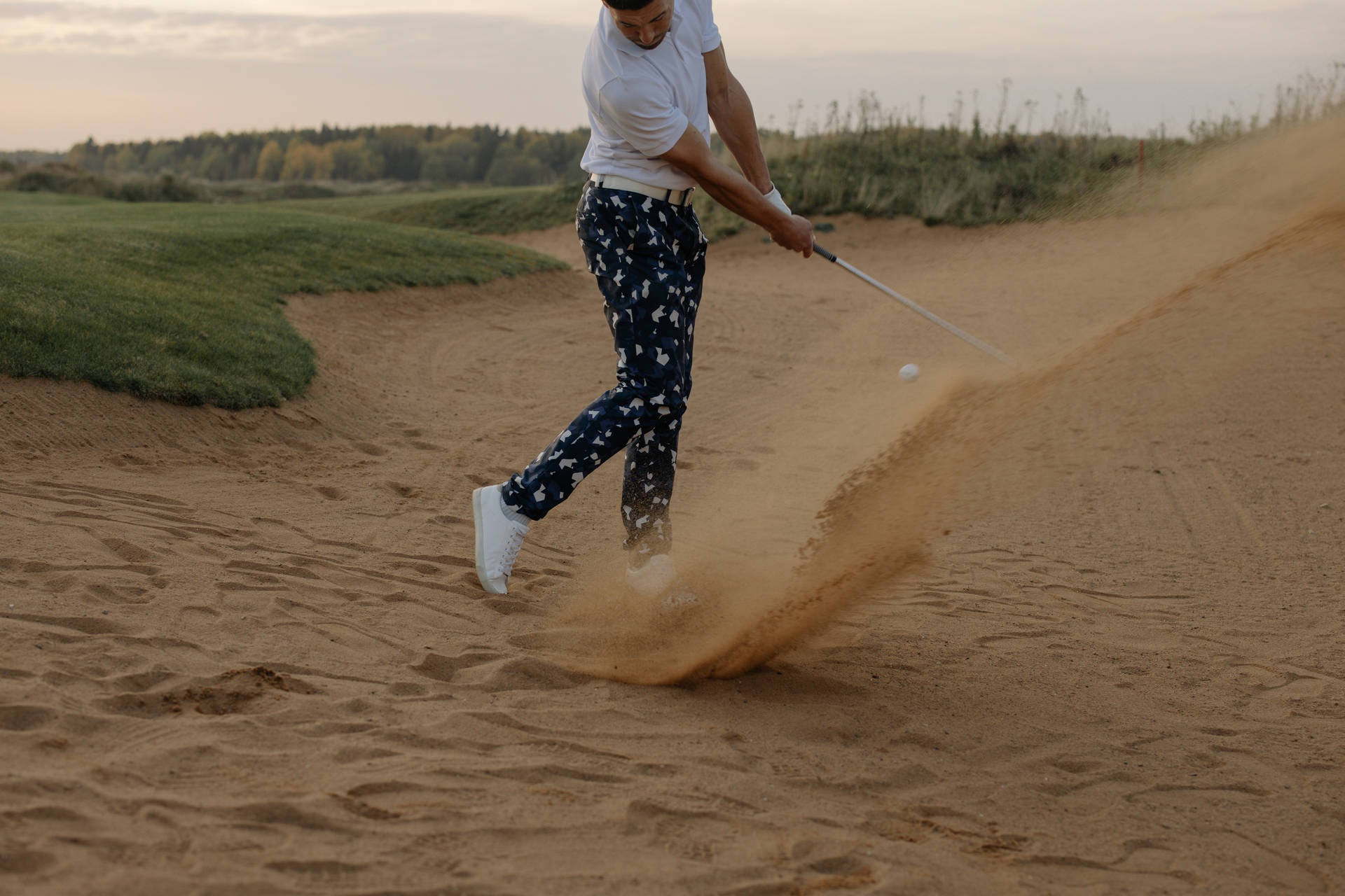 4k Man Playing Golf On Sand Wallpaper