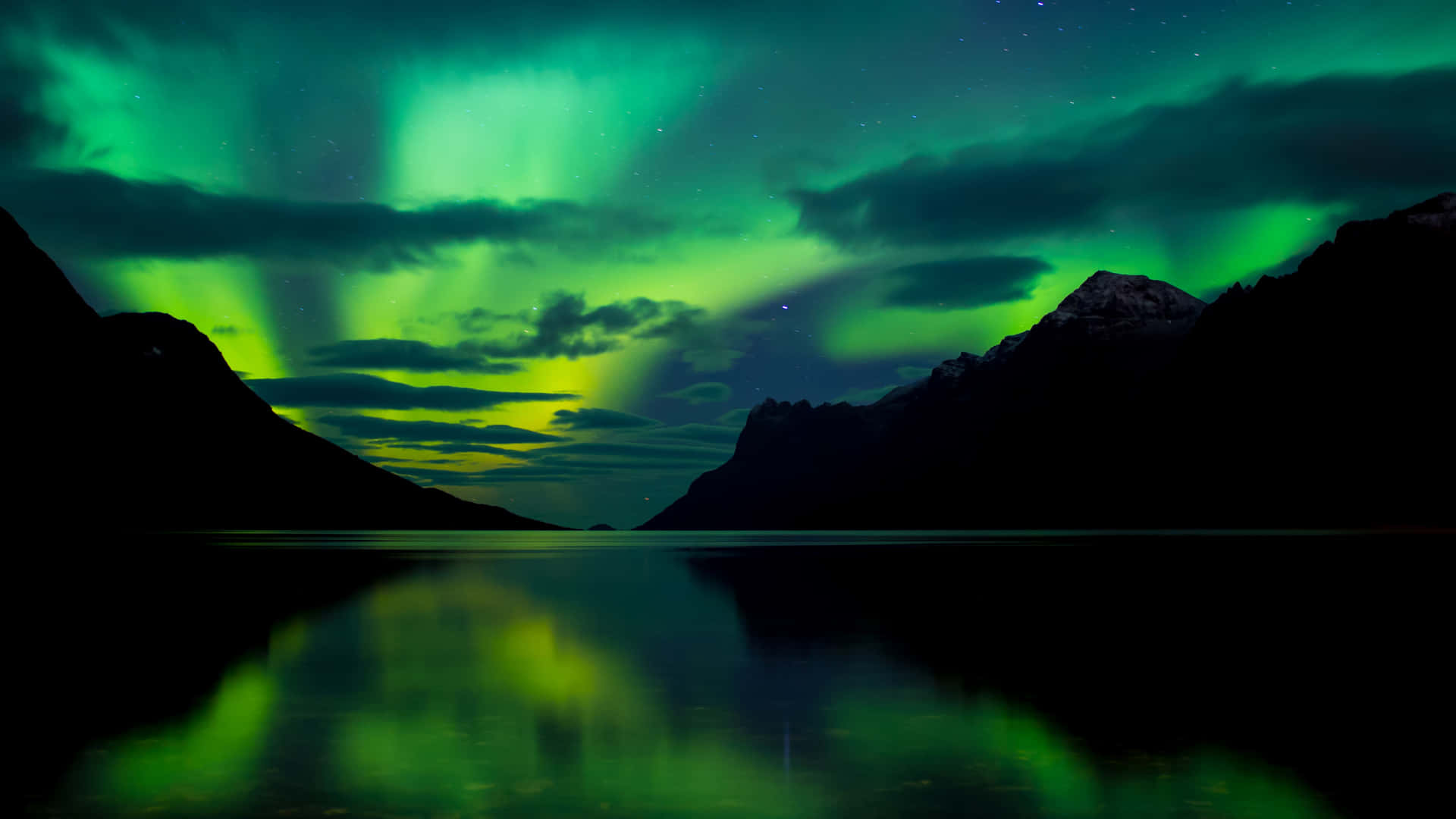 The Aurora Borealis Over A Mountain Lake