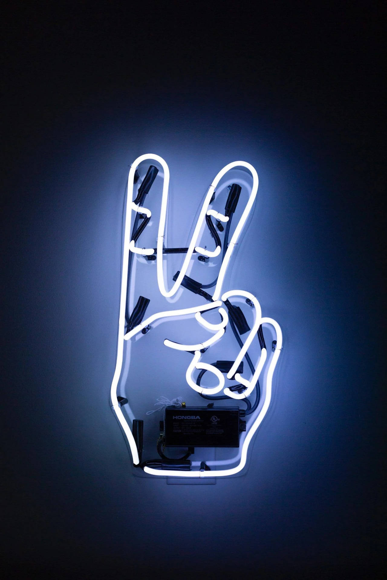 Dynamic 4K Neon iPhone Wallpaper Featuring a Peace Signage in Vibrant Colors Wallpaper