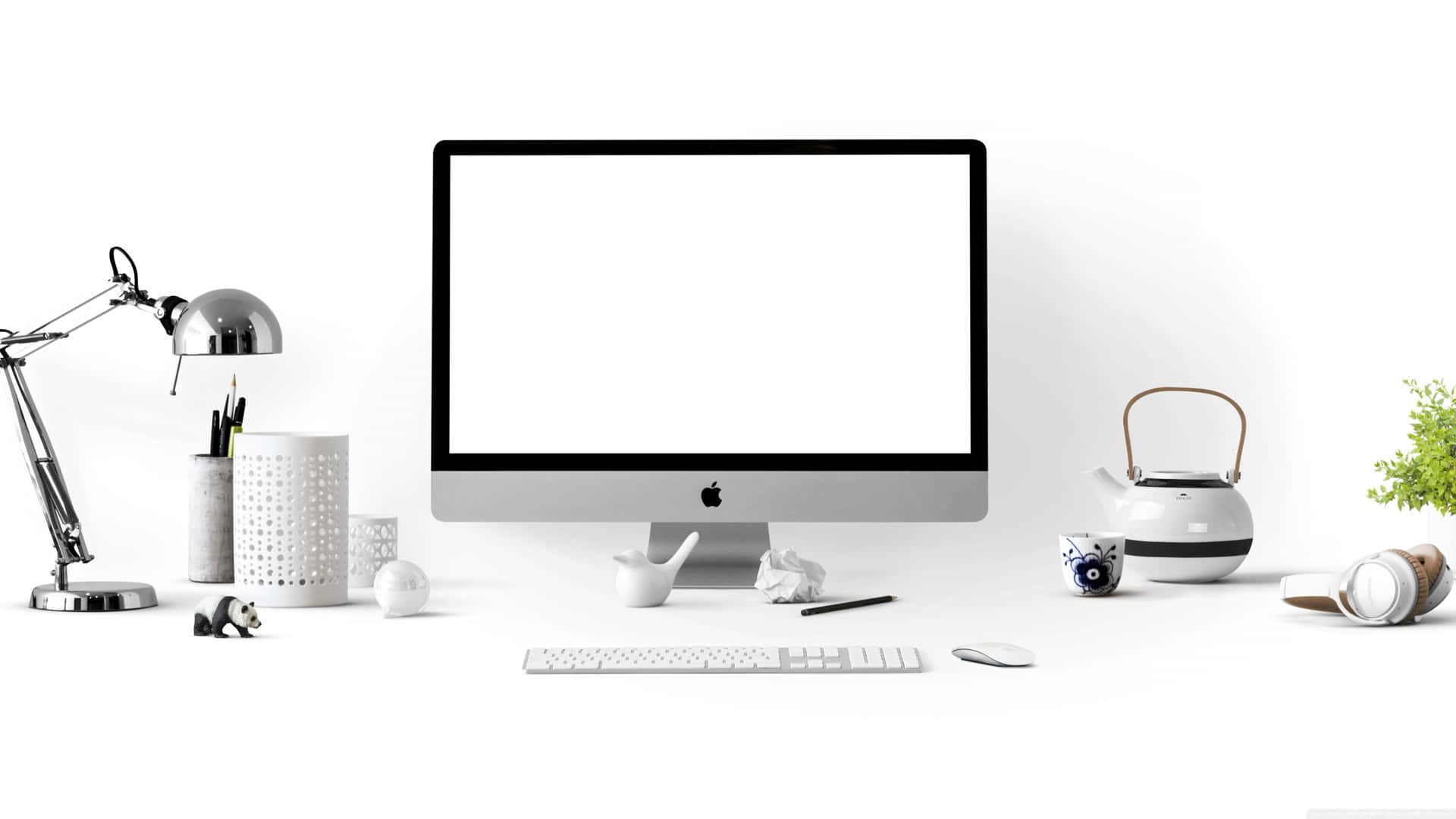 a white computer with a white screen and other items