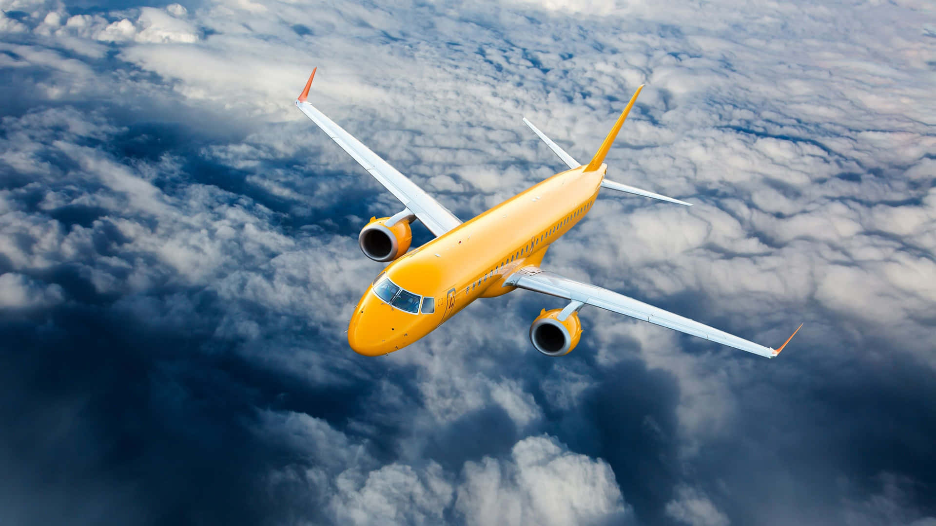 A Yellow Airplane Flying In The Sky Wallpaper