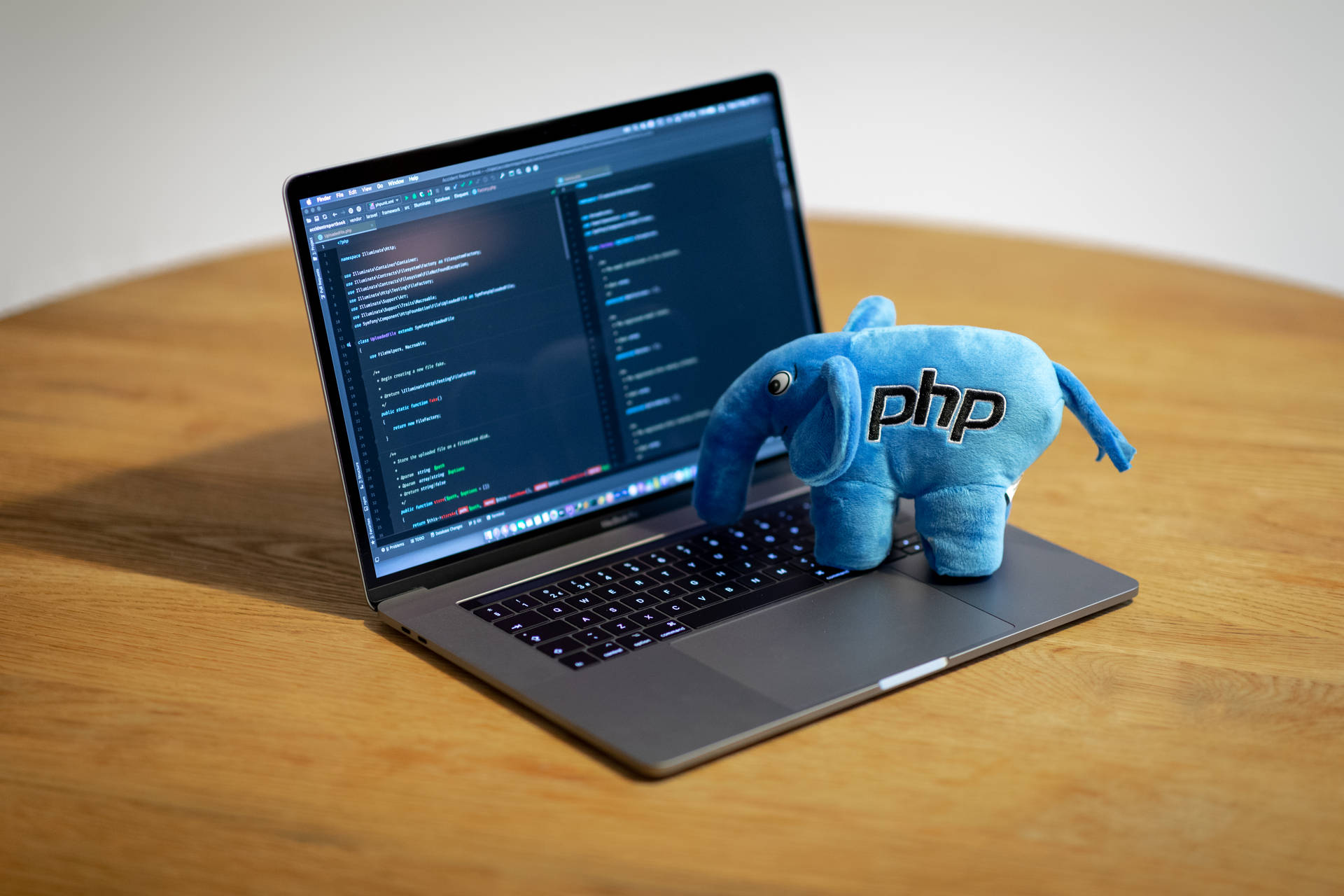 4k Programming Laptop With Elephant Plushie Background