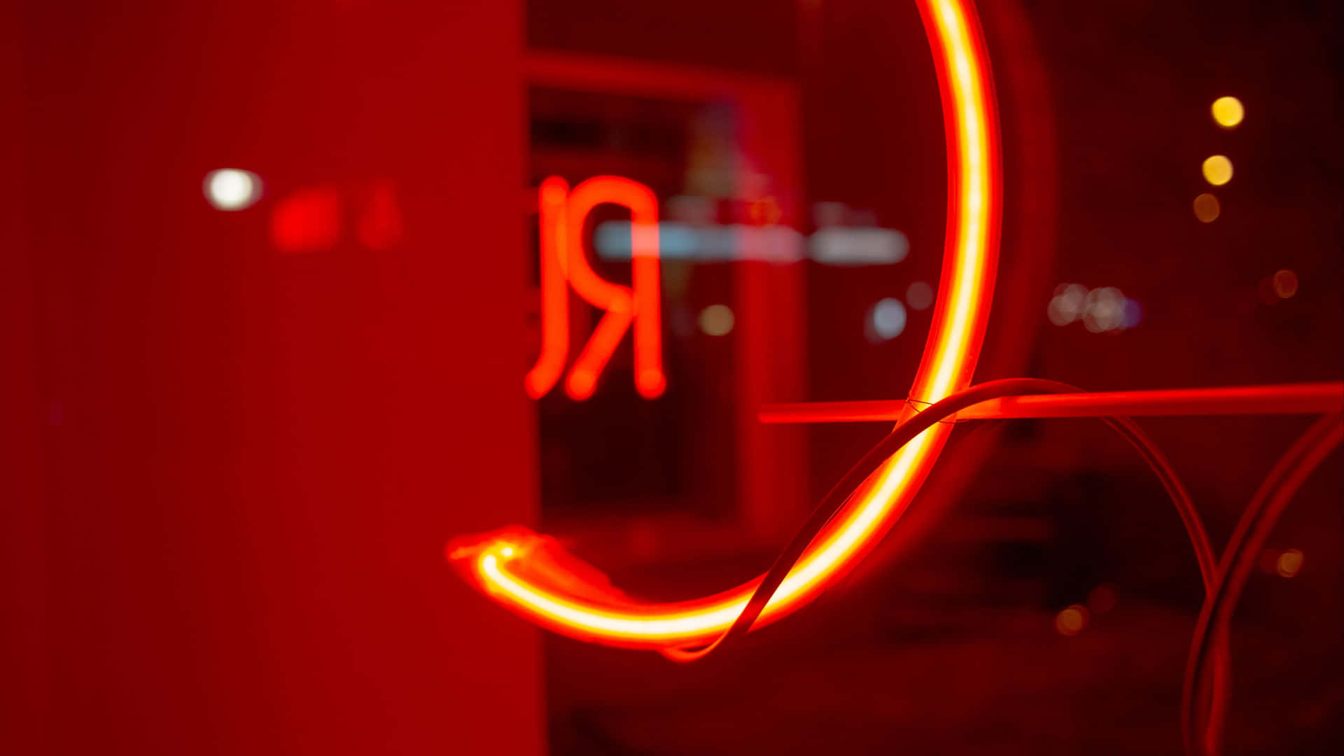 Brighten up your workspace with a bold 4K Red Neon wallpaper Wallpaper
