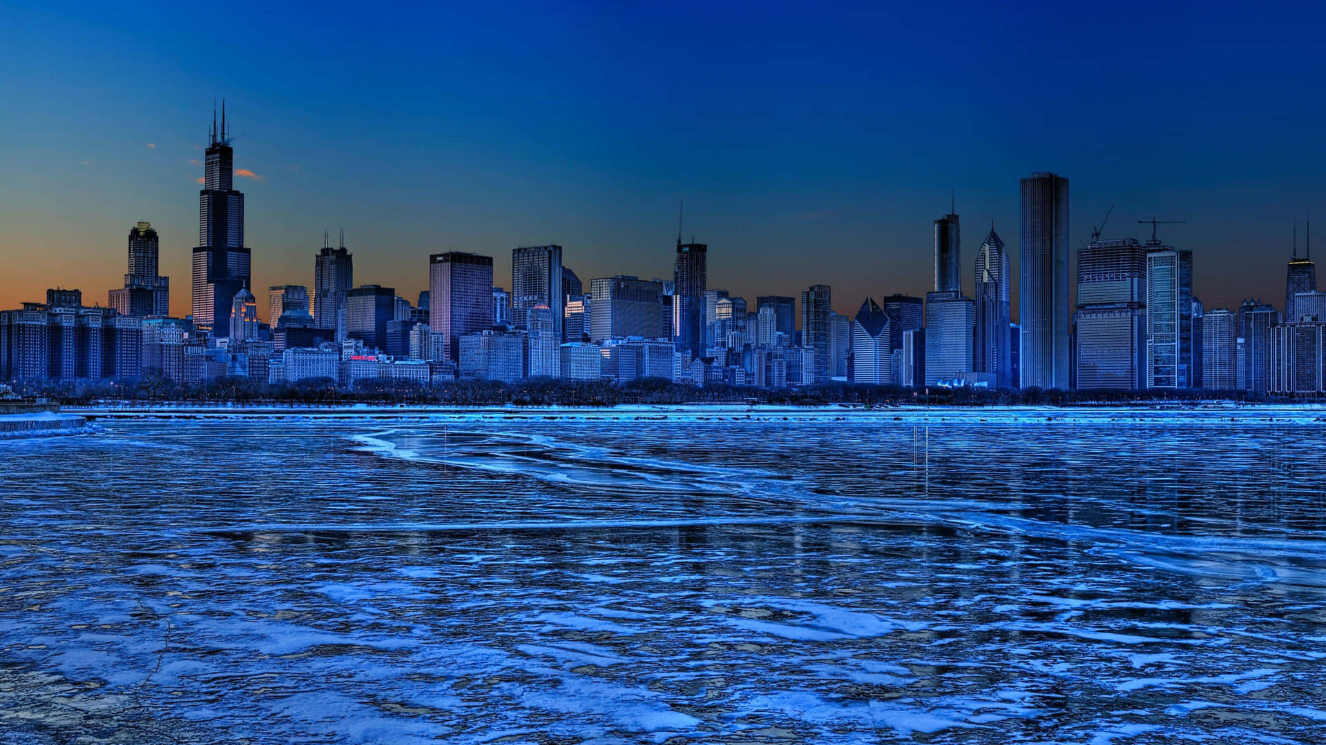 A City Skyline With Ice And Snow In The Background Wallpaper