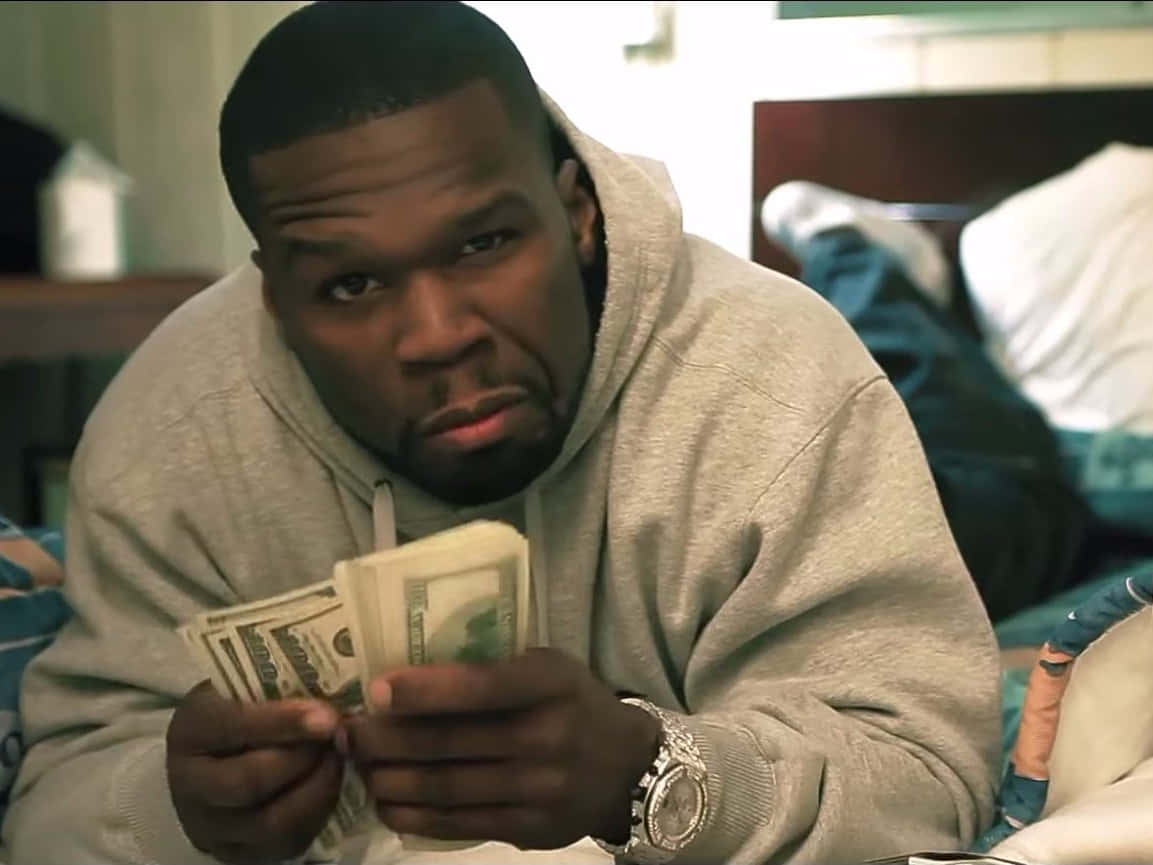 50 Cent poses for the camera.
