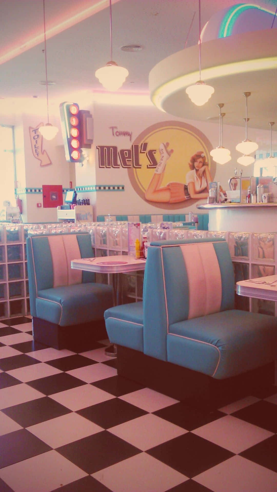 Vintage 50s diner with two classic cars parked