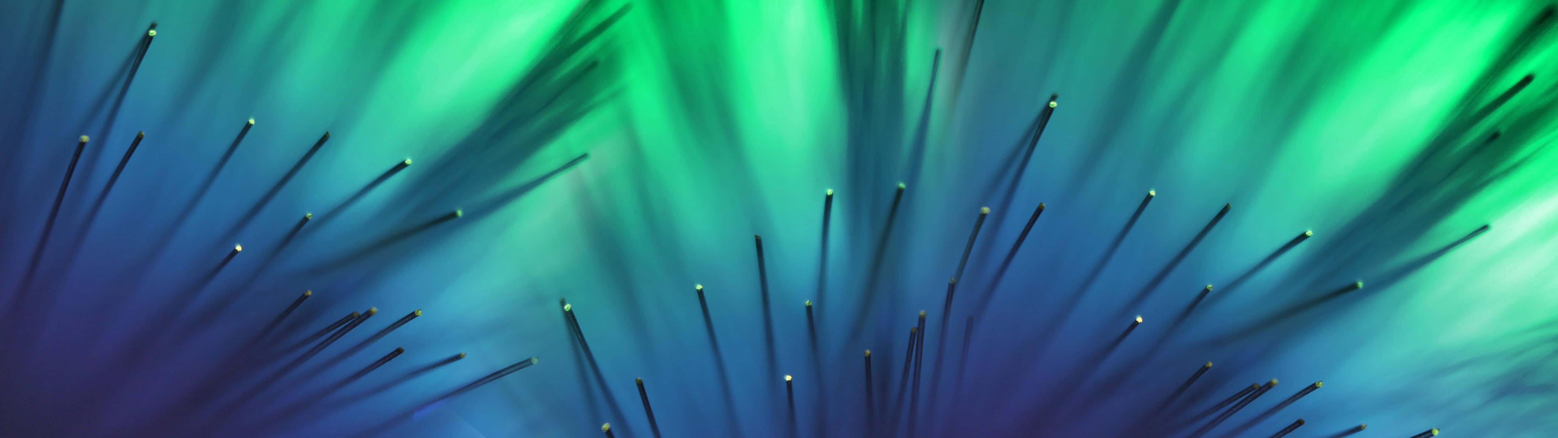 A Green And Blue Background With A Lot Of Spikes Wallpaper