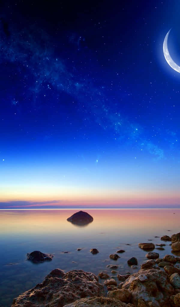 A Crescent And Stars Over The Water Wallpaper