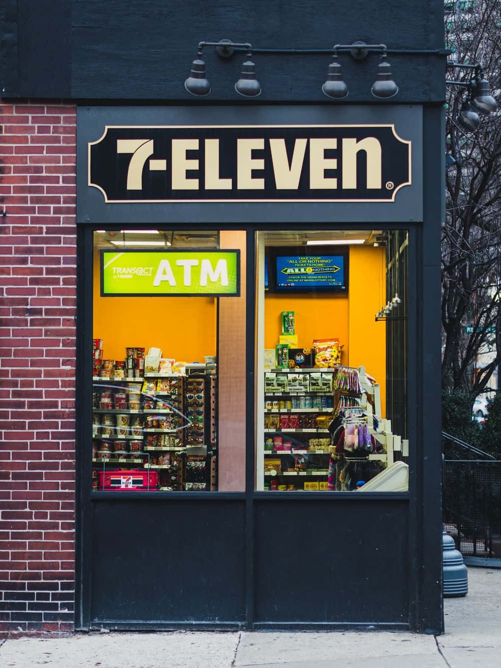 A Storefront With A Sign That Says Seven Eleven