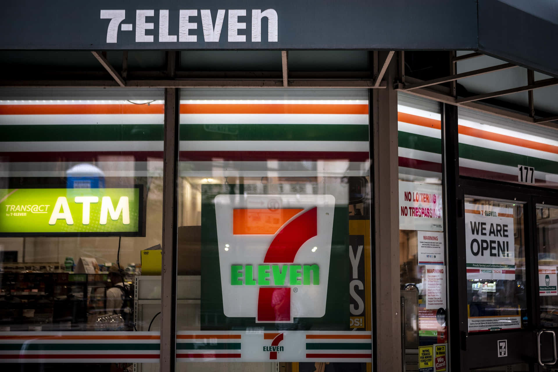 A 7 Eleven Store With A Sign On The Front