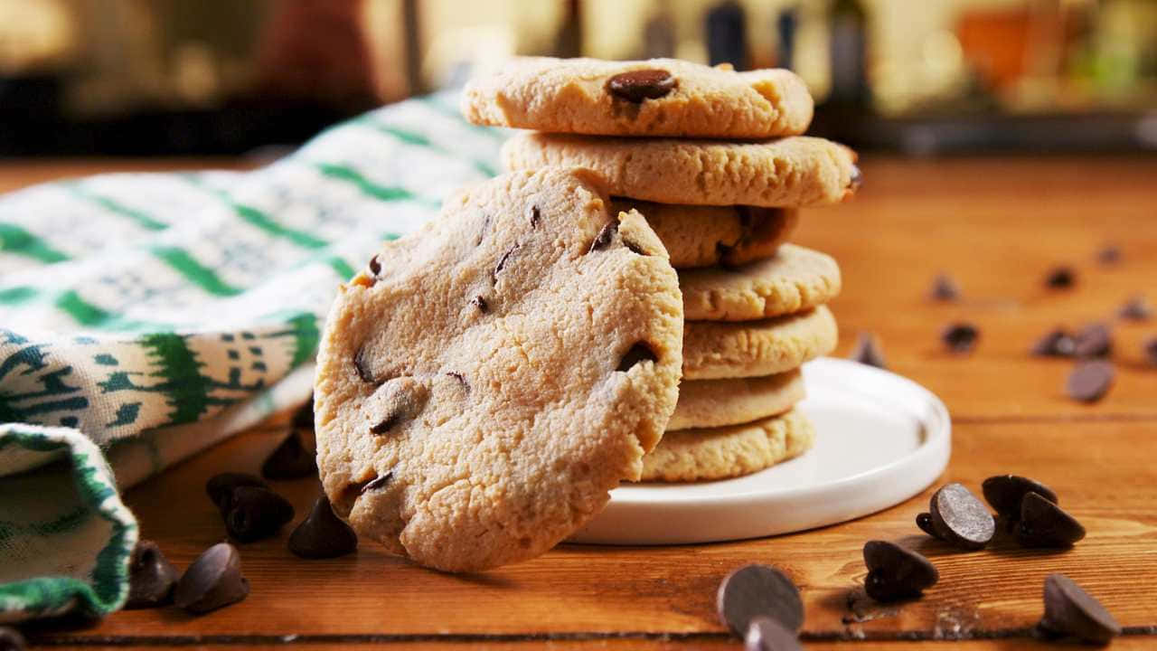 A Stack Of Chocolate Chip Cookies On A White Plate
