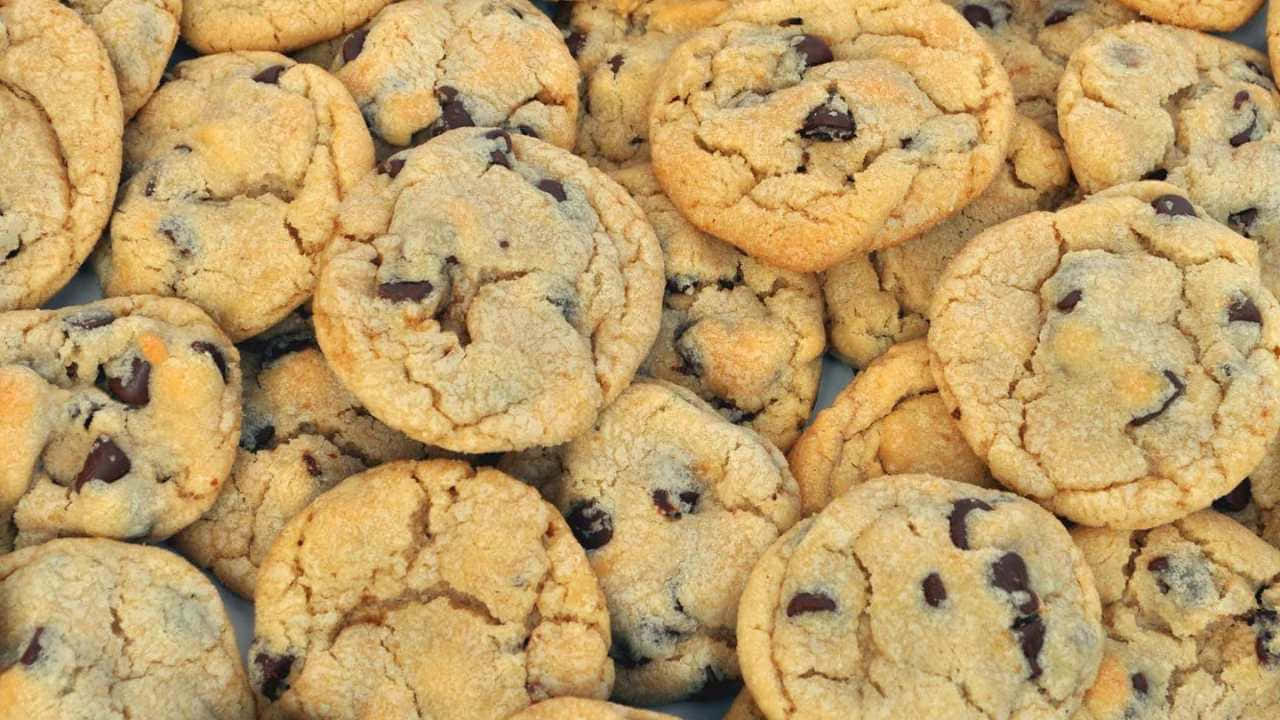 A Pile Of Chocolate Chip Cookies On A Plate