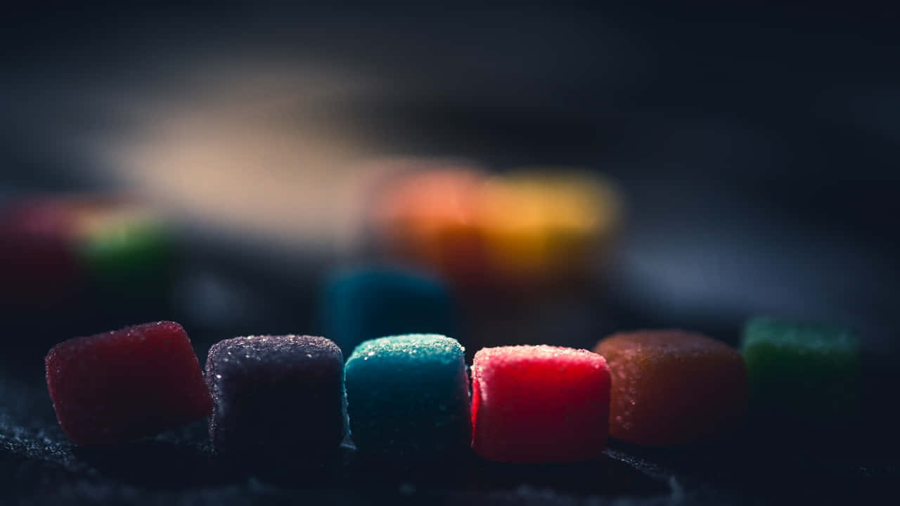 Colorful Candy Cubes On A Dark Background