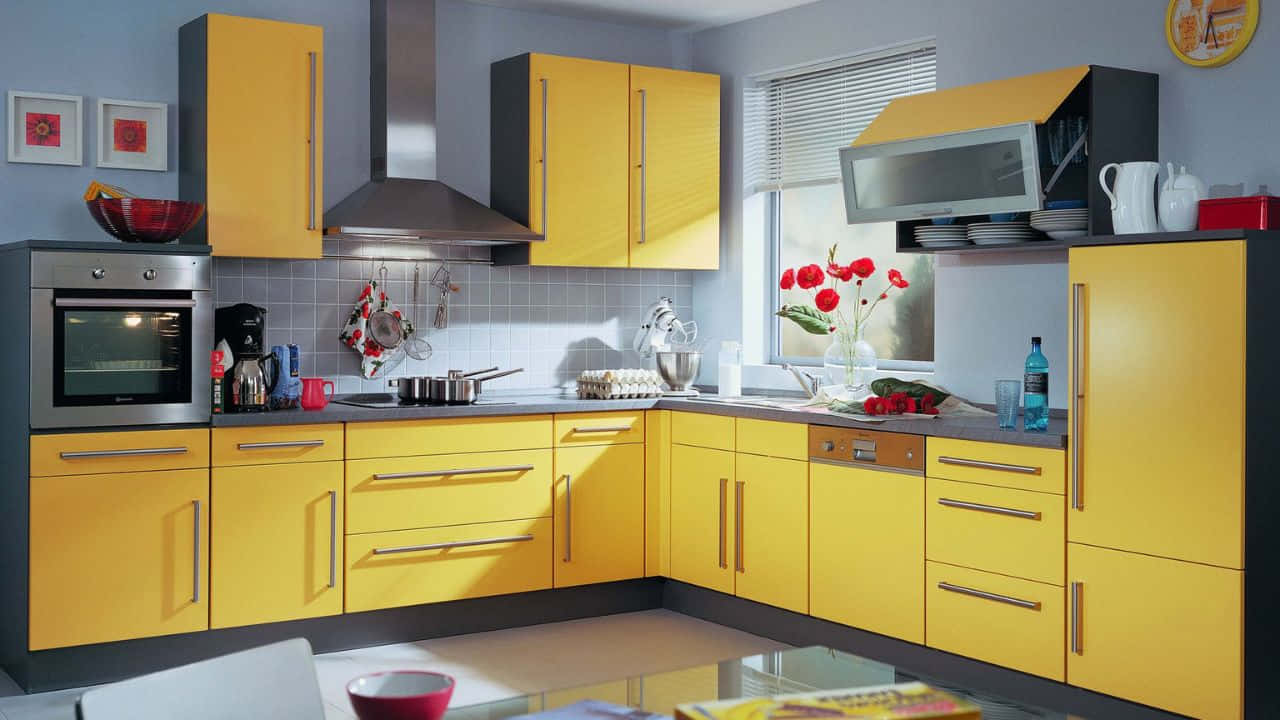 A Kitchen With Yellow Cabinets And A Black Stove