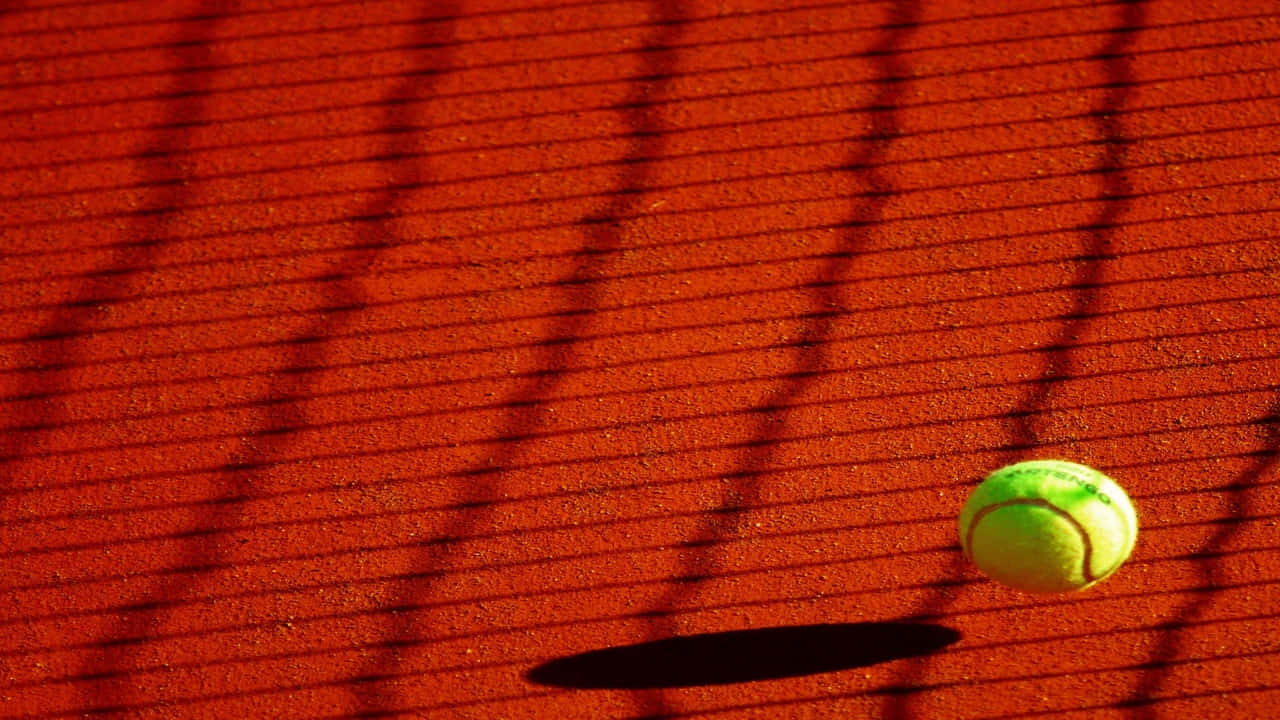 A Tennis Ball On A Tennis Court
