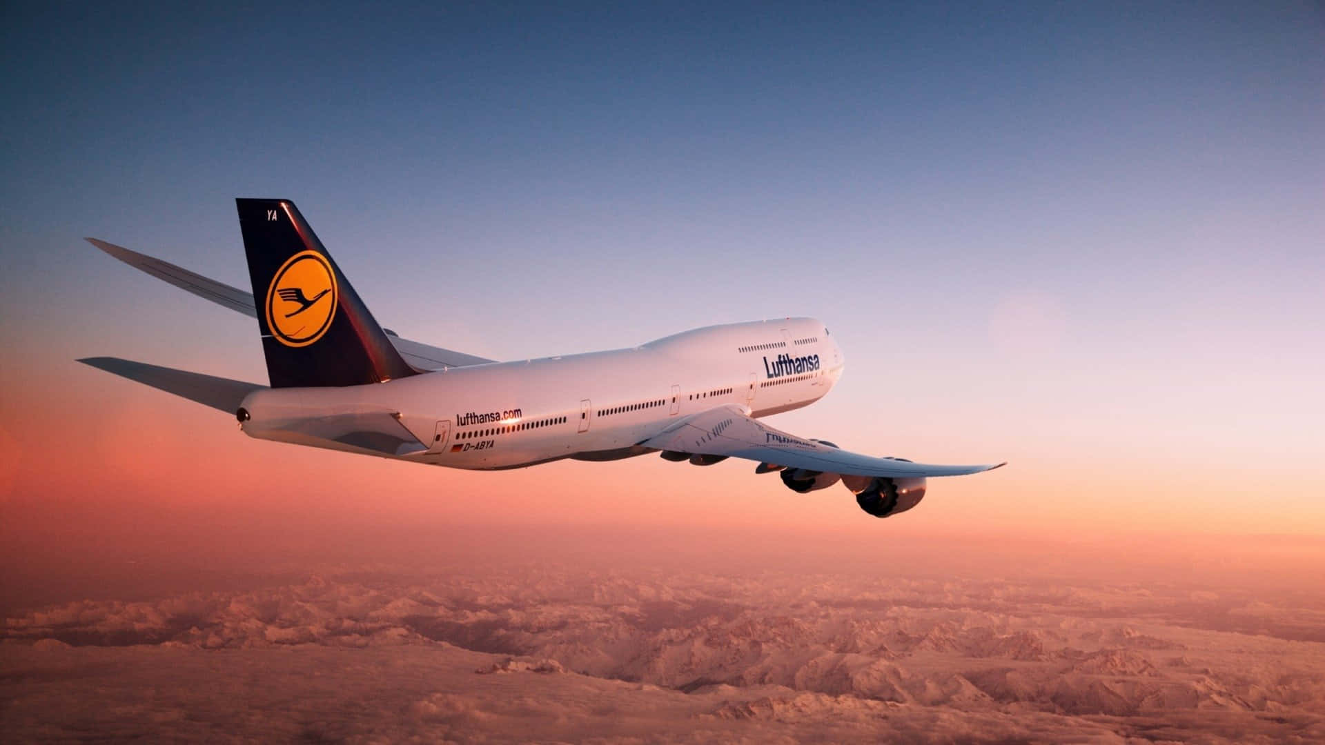 The Majestic 747 Airplane Soaring in the Skies Wallpaper