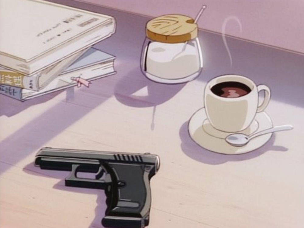 a gun and coffee on a table Wallpaper