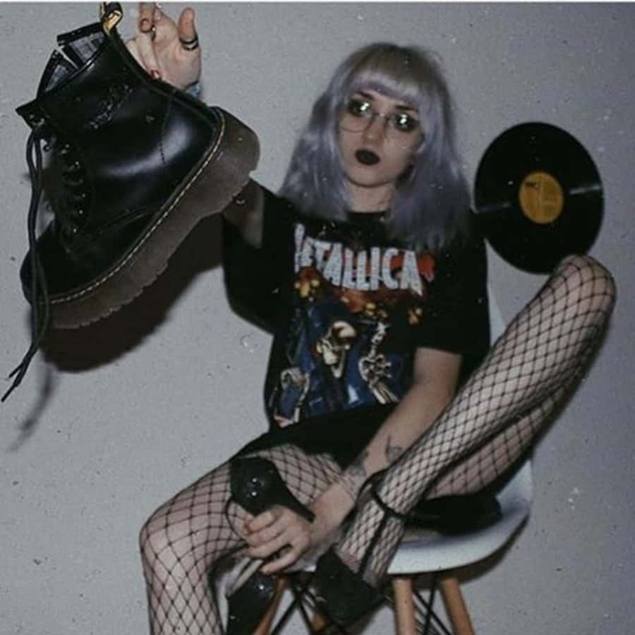A Girl With Fishnet Stockings And A Pair Of Dr Martens Shoes Wallpaper