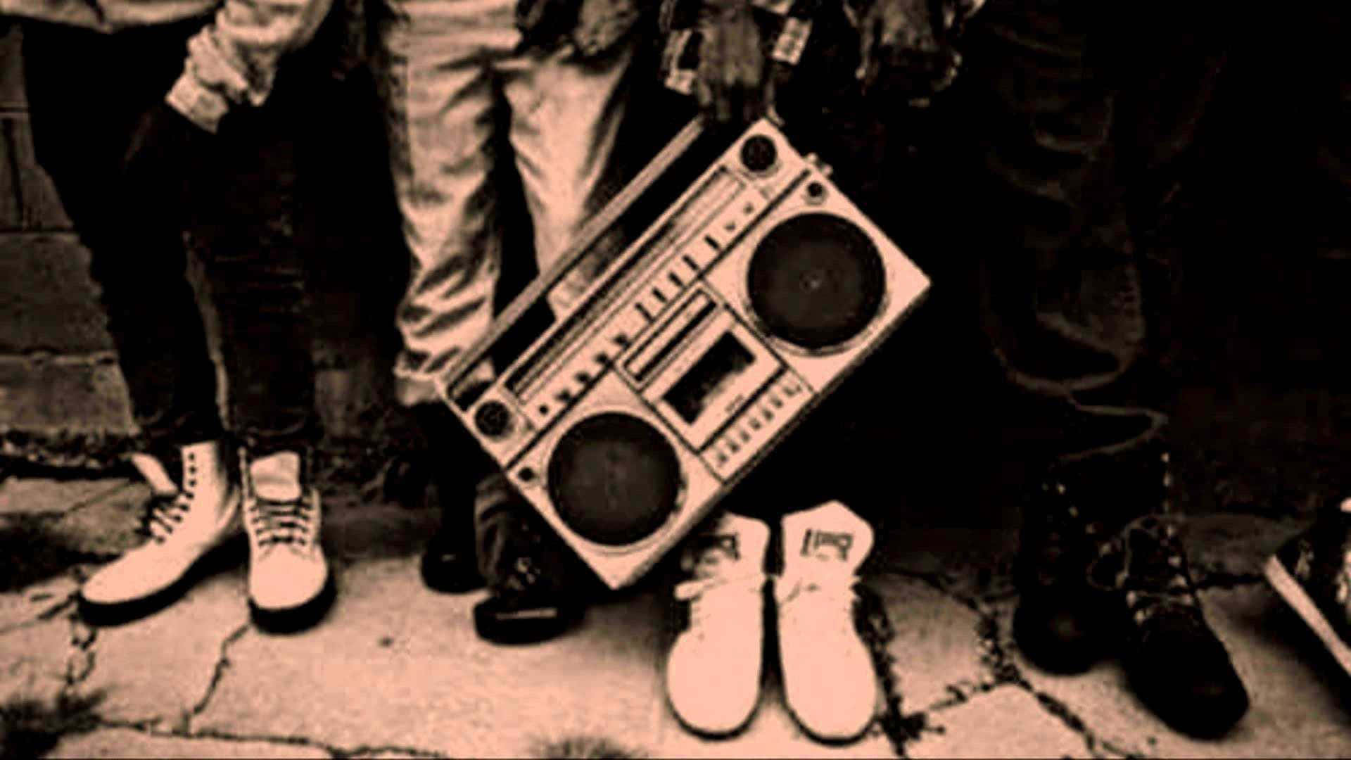 Download A Group Of People Standing Next To A Boombox Wallpaper |  