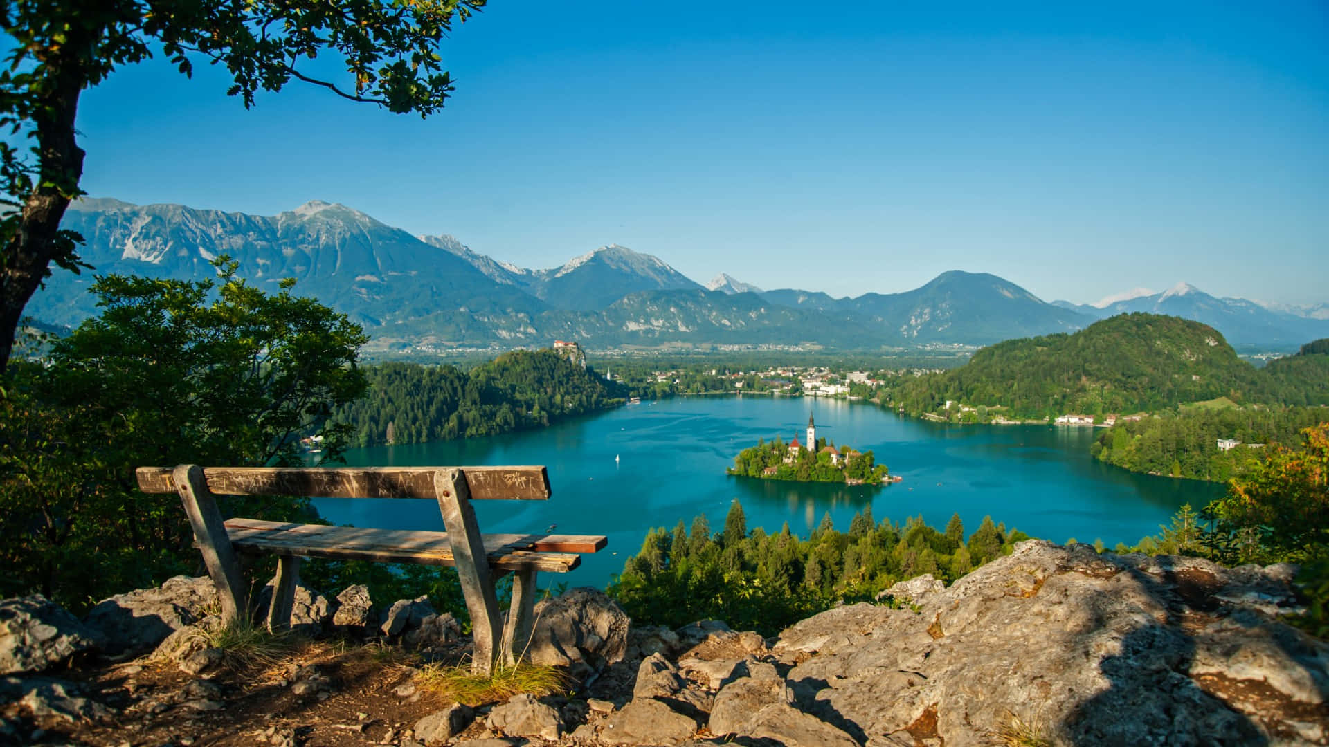 A Bench At The Mountain Peak Overlooking Lake Bled Wallpaper