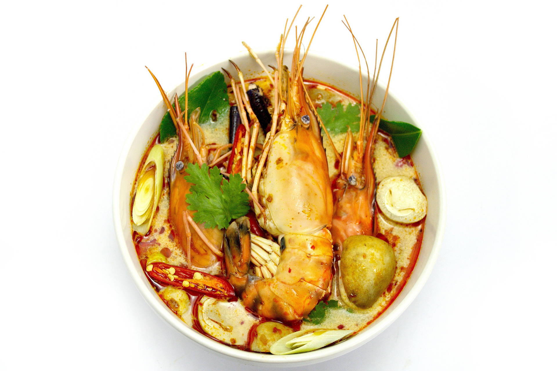 A Delicious Bowl of Tom Yum Soup with Big Prawns Wallpaper