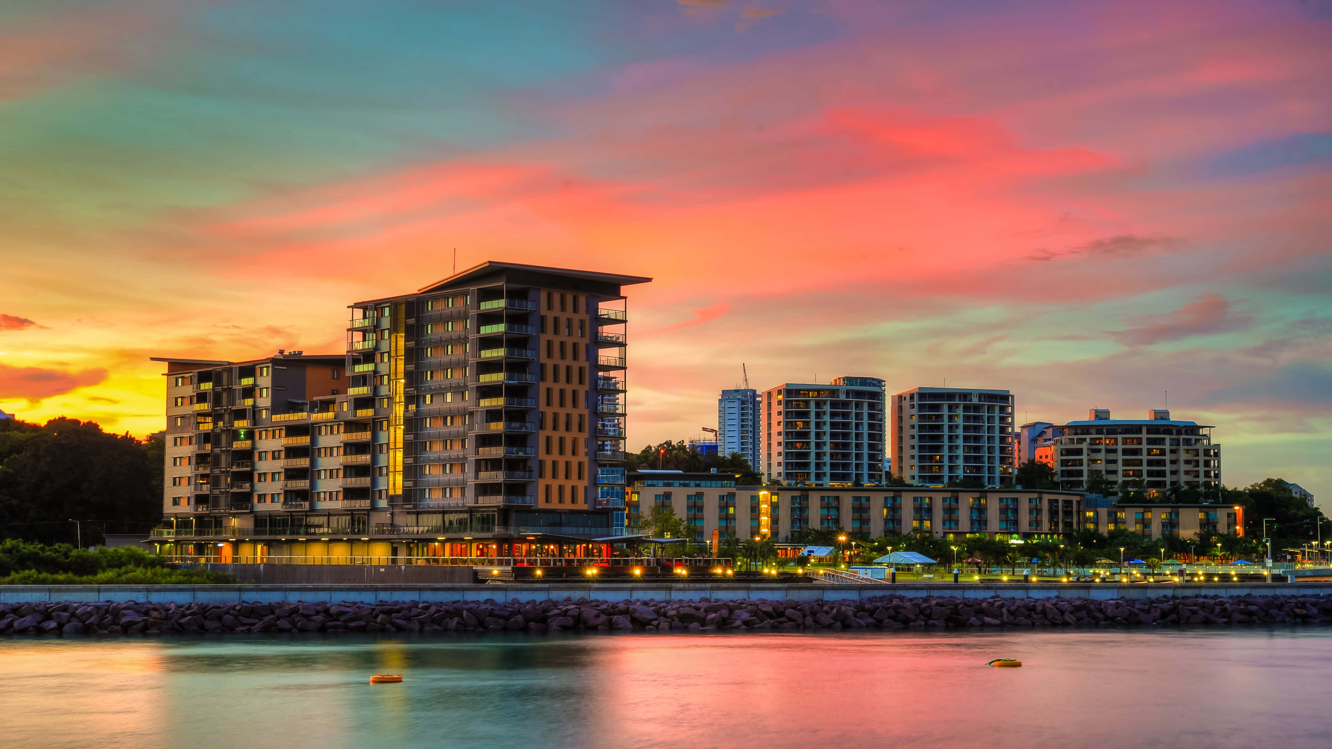 A Breathtaking View Of A Darwin Sunset. A Serenity Untouched By Havoc, Painting The Day With Hues Of Orange, Pink And Purple. Wallpaper