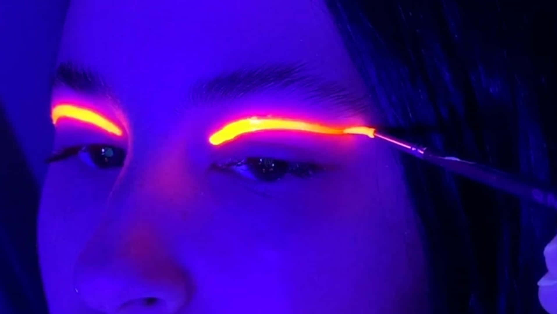 A Burst Of Neon Glow: Unleashing Creativity With Black Light Makeup. Wallpaper
