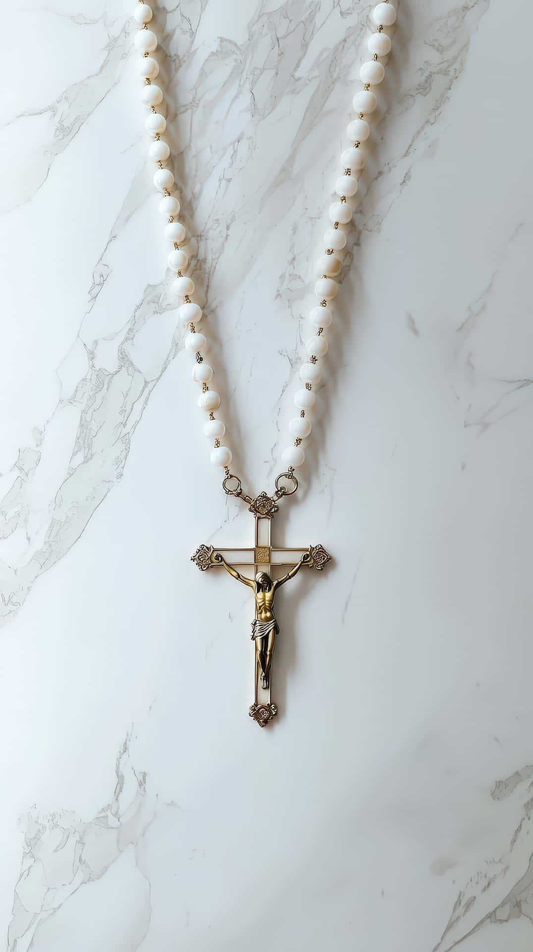 A Catholic Rosary With White Beads And A Golden Crucifix Featuring Jesus Christ Wallpaper