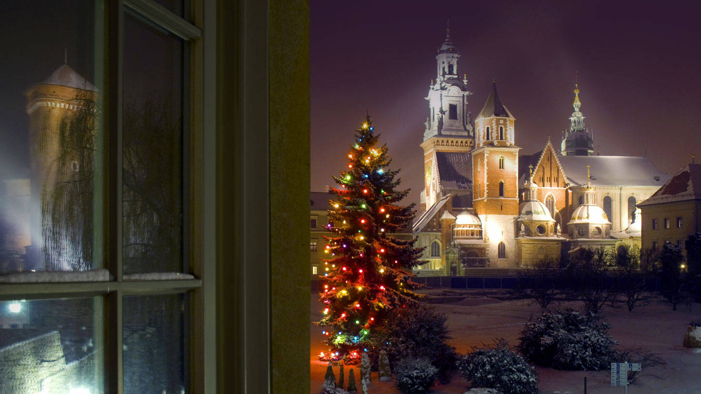 A Christmas Tree In Krakow Old Town Poland During Winter Wallpaper