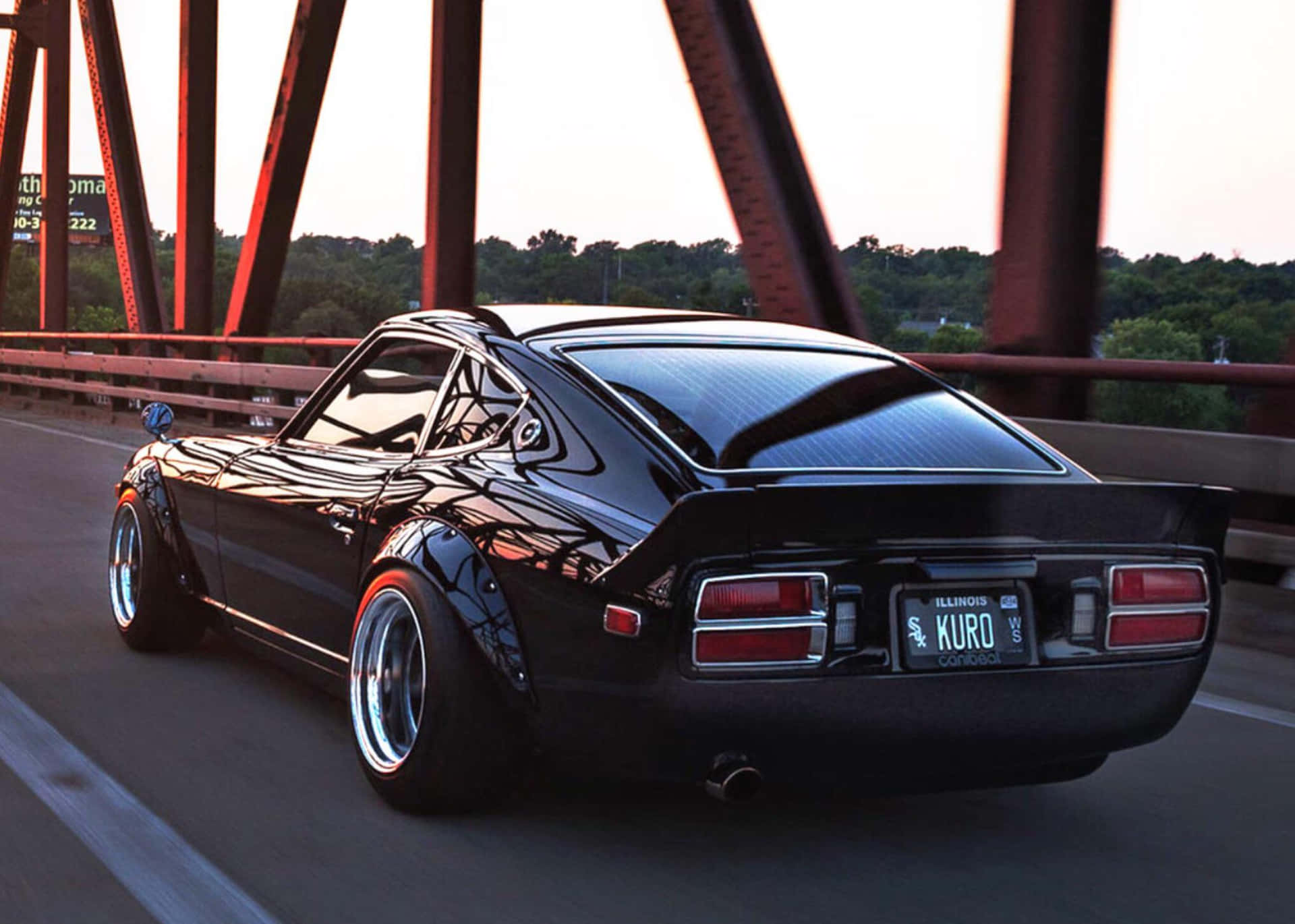 A Classic Datsun 240z Gleaming In The Sunset Wallpaper