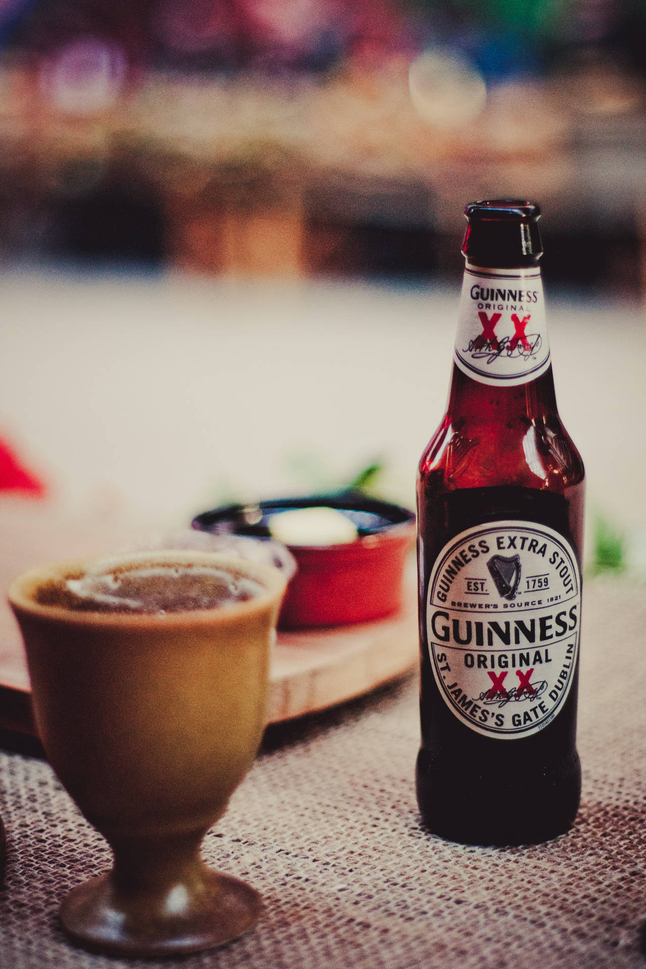 A Classic Pint Of Guinness Stout Beer Waiting To Be Enjoyed. Wallpaper