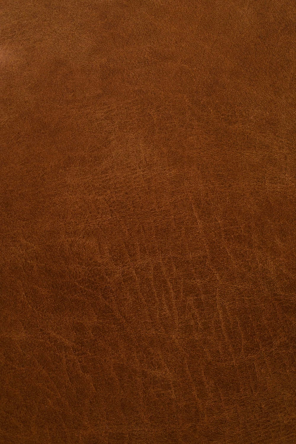 A Close-up Of A Rich Brown Leather Texture Wallpaper