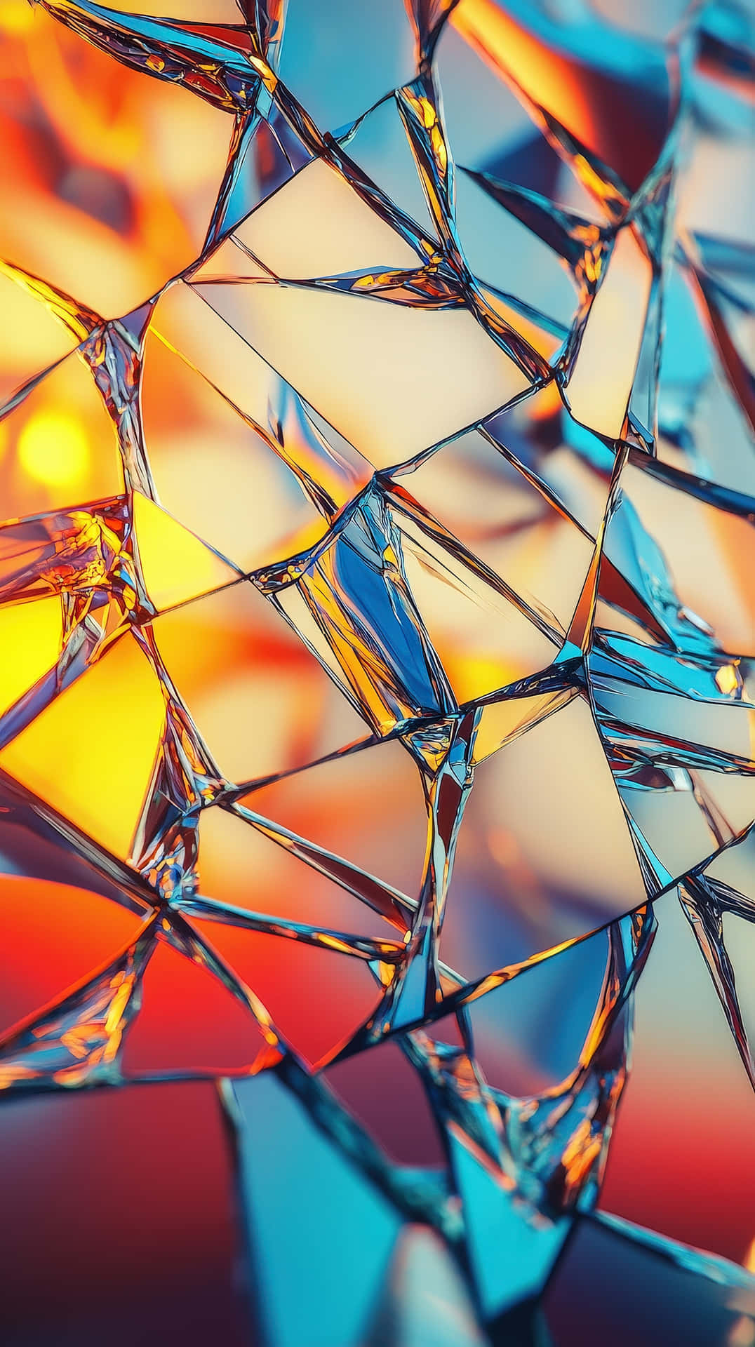 A Close-up Of Broken Glass Reflecting Vivid Warm And Cool Tones Wallpaper