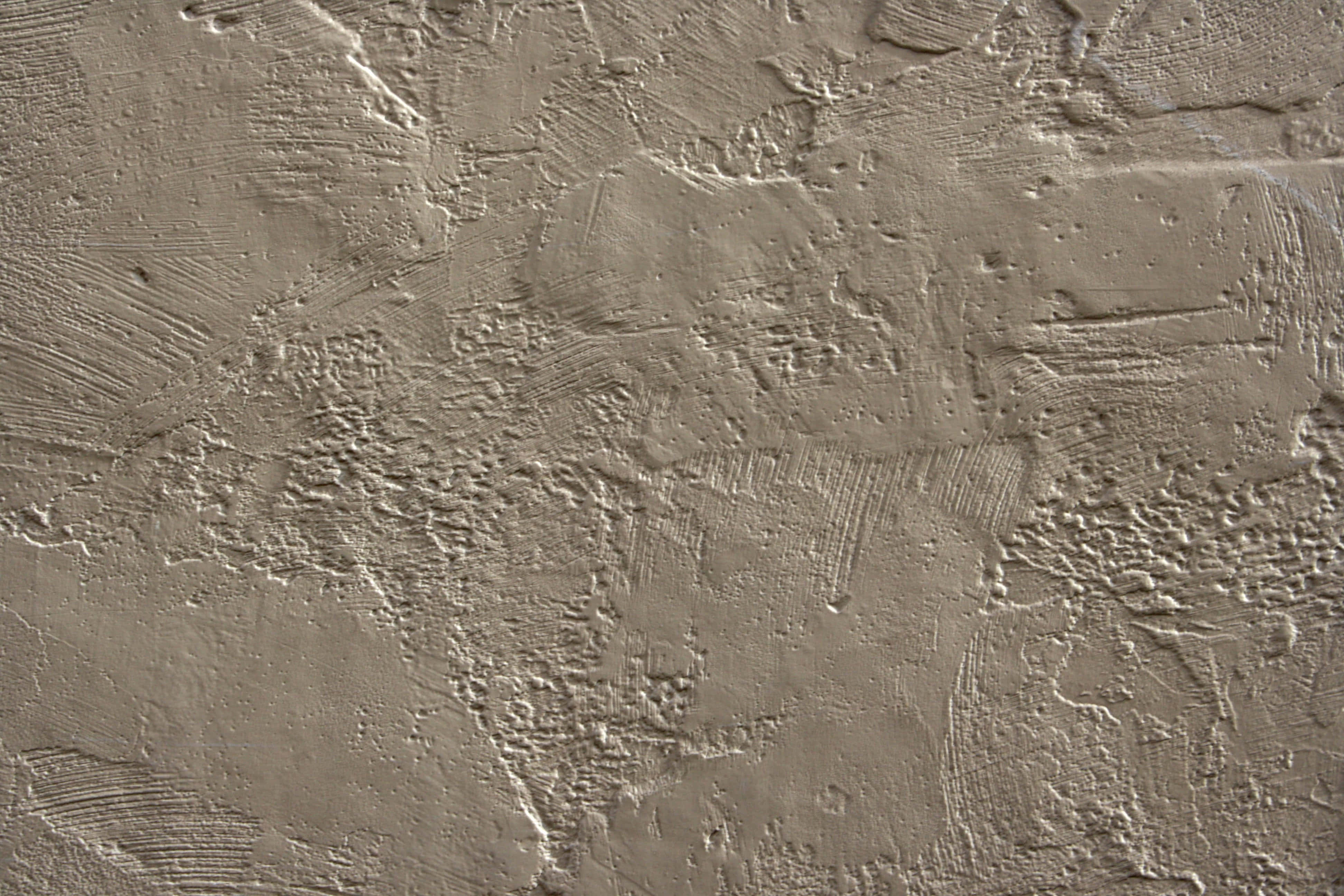 A Close-up View Of A Stucco Wall Texture Wallpaper