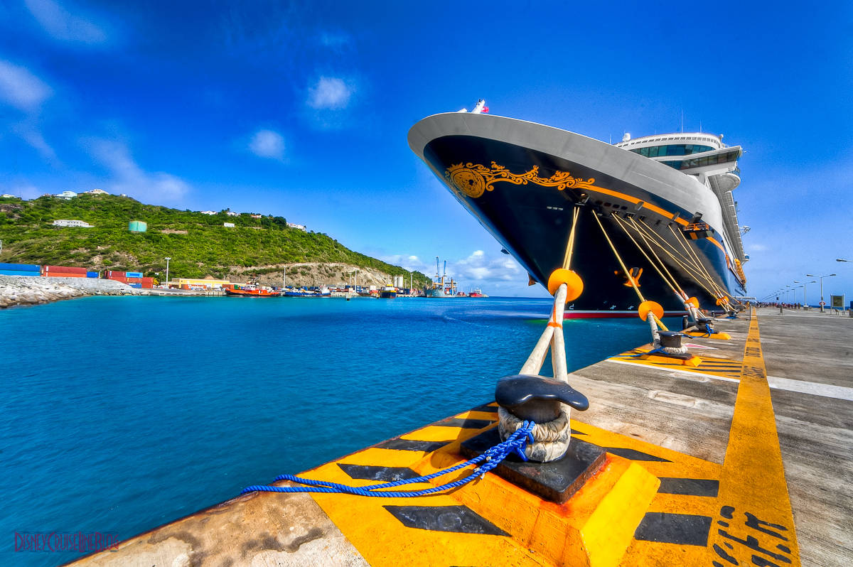 A Cruise Ship Docked In Sint Maarten Beach Wallpaper