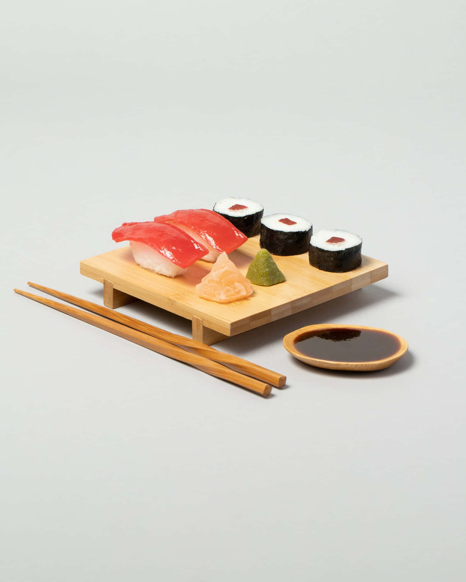 A Delicious Spread Of Sushi On A Bamboo Mat