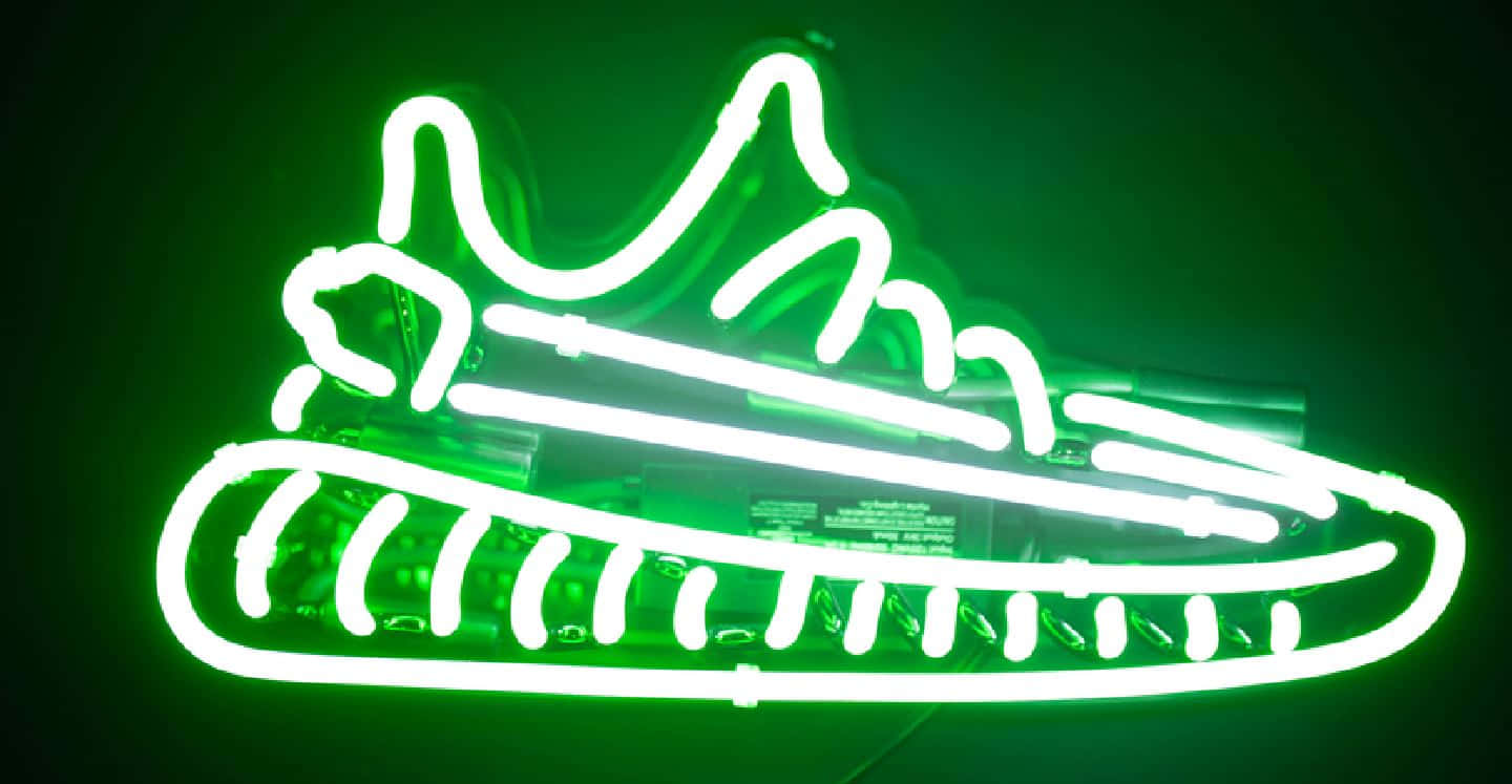 A Fashionable Pair Of Neon Shoes Lighting Up The Floor. Wallpaper