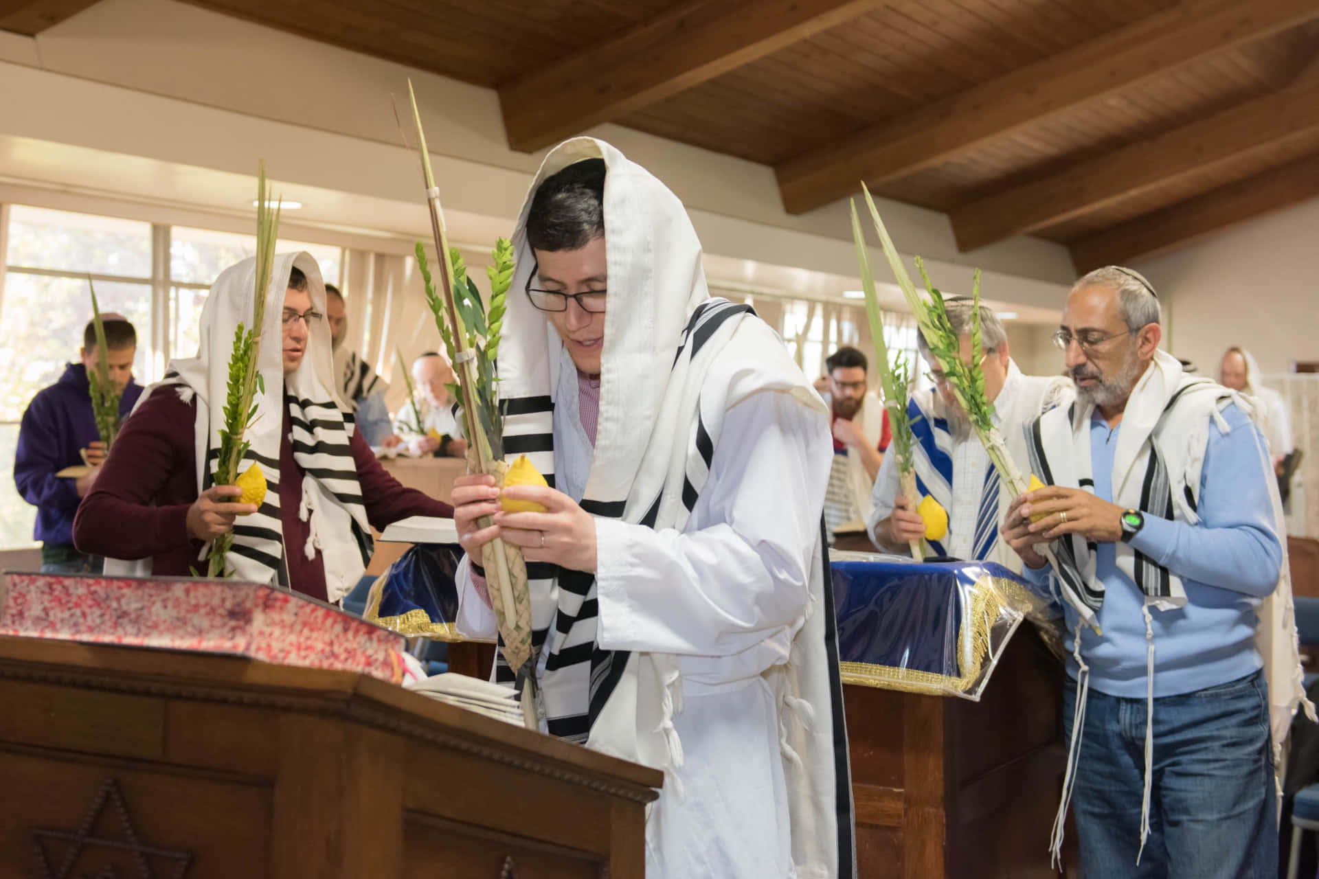 Download A Jewish Man Holding A Lulav And Etrog During Hoshana Rabbah 