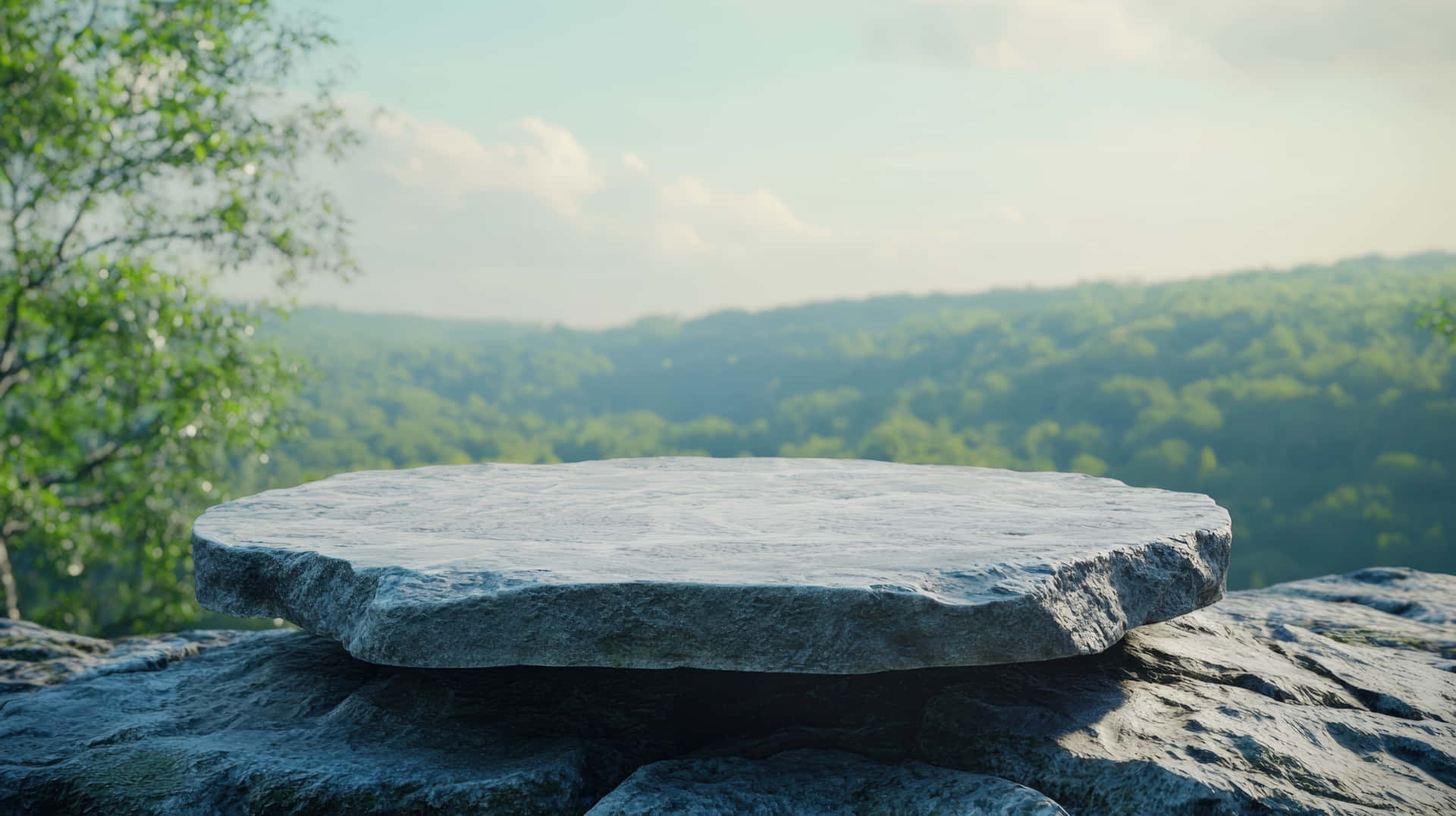 A Large, Round Stone Platform In The Foreground Offers A Panoramic View Of A Lush Green Valley Wallpaper