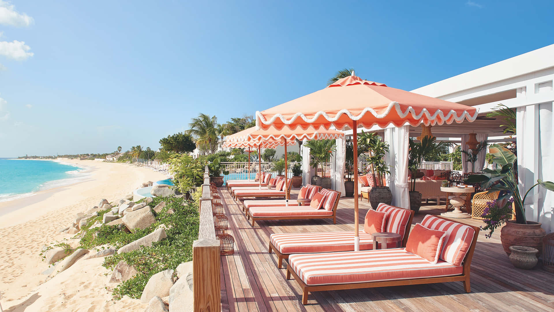 A Luxurious Beach Resort At Sunset Wallpaper