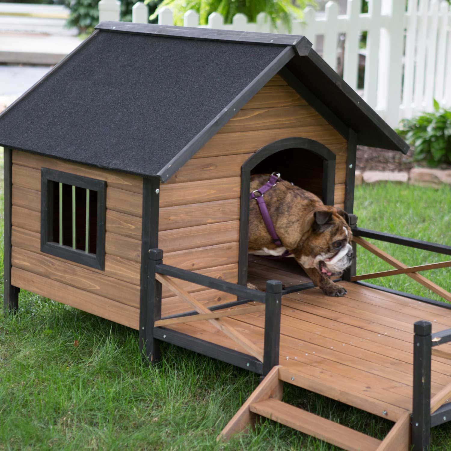 A Majestic And Expertly Crafted Wooden Dog House Nestled In A Lush Green Garden. Wallpaper