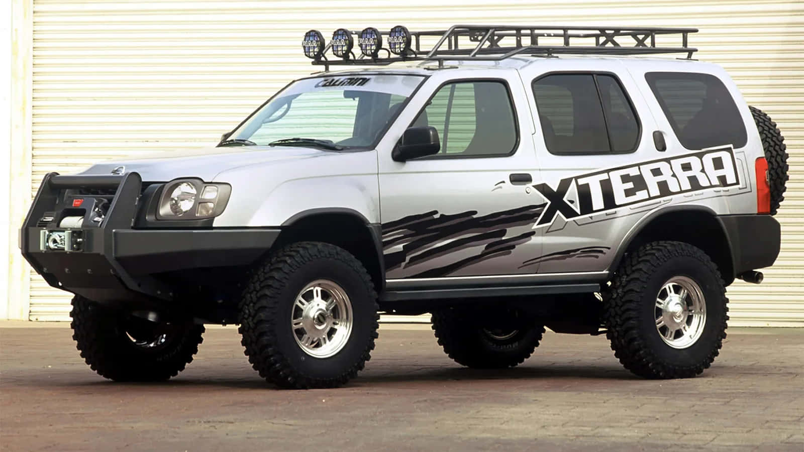 A Majestic Nissan Xterra Off-roading In Rugged Terrain Wallpaper