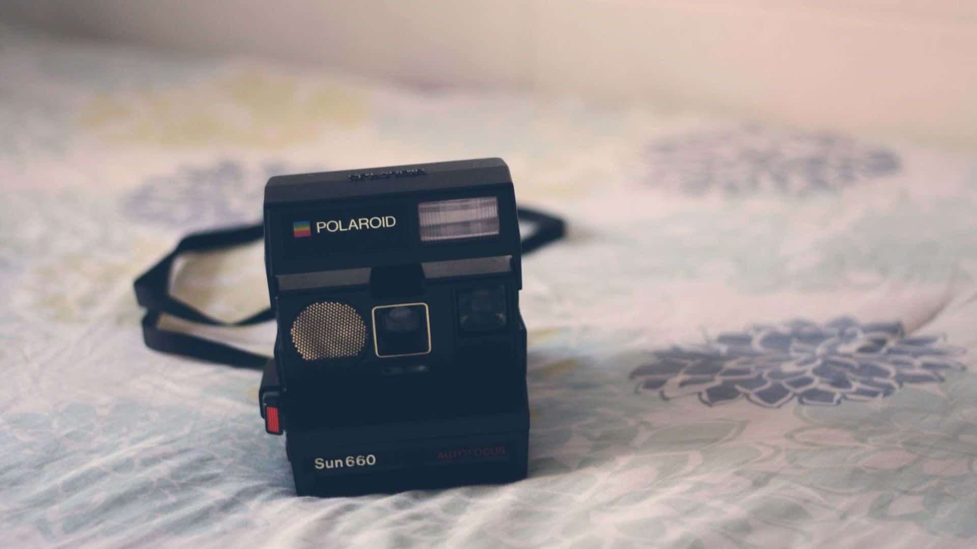 A Memorable Snapshot With Vintage Polaroid Camera Wallpaper
