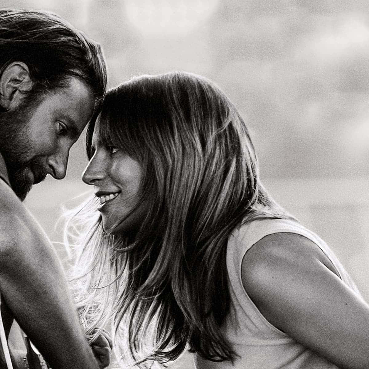 A Passionate Moment Between Bradley Cooper And Lady Gaga In A Star Is Born Wallpaper