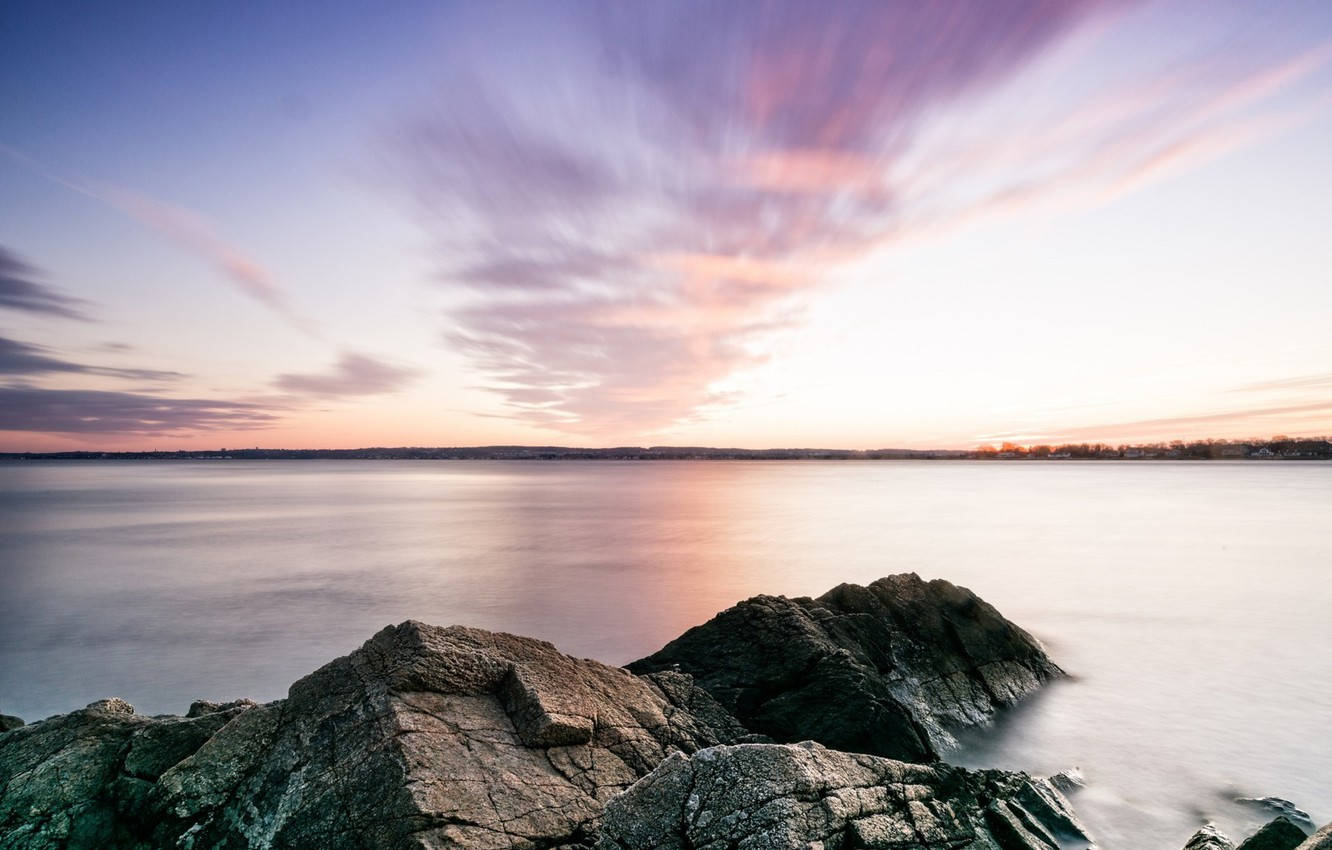 A Peaceful Sunrise At The Beach In Rhode Island Wallpaper